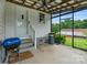 Cozy covered porch featuring an outdoor fan, offering a relaxing space to enjoy the outdoors in comfort at 956 Stony Point Rd, Kings Mountain, NC 28086