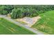 The aerial view shows the location of the home between the road and cornfields at 977 Myers Mill Rd, Olin, NC 28660