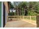 Spacious back deck with wooden railings, perfect for outdoor entertaining and enjoying nature views at 977 Myers Mill Rd, Olin, NC 28660