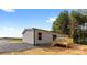 View of the back of the home features a deck and siding at 977 Myers Mill Rd, Olin, NC 28660