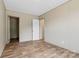 The bedroom features wood-look flooring, neutral walls, and convenient closet access at 977 Myers Mill Rd, Olin, NC 28660