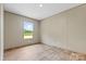 This bedroom has lovely wood-look flooring and a window view of lush landscape at 977 Myers Mill Rd, Olin, NC 28660