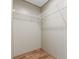 Bright walk-in closet offering ample storage with wire shelving and laminate wood floor at 977 Myers Mill Rd, Olin, NC 28660