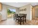 Charming dining area with wood table, seating for six, and sliding door to a deck at 977 Myers Mill Rd, Olin, NC 28660