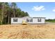 Inviting home with a classic design, featuring a well-manicured lawn at 977 Myers Mill Rd, Olin, NC 28660