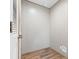 Bright laundry room with vinyl flooring, textured walls, and modern fixtures at 977 Myers Mill Rd, Olin, NC 28660