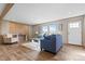 Cozy living room with a comfortable seating area, wood flooring, and ample natural light at 977 Myers Mill Rd, Olin, NC 28660