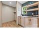 Practical mudroom with cabinets, shelves, and a window, offering a functional storage space at 977 Myers Mill Rd, Olin, NC 28660