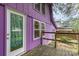 Close up of a purple house featuring a small wooden deck and a white glass door at 10 Cedarvilla Dr, Rock Hill, SC 29730