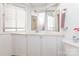 Bright bathroom featuring white cabinets and a decorative framed mirror at 10 Cedarvilla Dr, Rock Hill, SC 29730