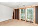 An unfinished bedroom shows the wood frame construction to the window at 10 Cedarvilla Dr, Rock Hill, SC 29730
