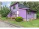 Charming two story home painted purple, with a dark roof and a well maintained yard with green grass at 10 Cedarvilla Dr, Rock Hill, SC 29730