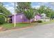 Charming two story home painted purple, with a dark roof and a small well maintained yard with a small tree at 10 Cedarvilla Dr, Rock Hill, SC 29730