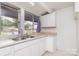 Kitchen features a double sink, white cabinets, and a neutral-colored countertop at 10 Cedarvilla Dr, Rock Hill, SC 29730