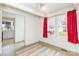 Bright room with large windows, red curtains, and doorway to kitchen at 10 Cedarvilla Dr, Rock Hill, SC 29730