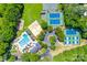 Aerial view of community amenities including pool, sand volleyball, tennis, and playground at 10215 Balmoral Cir, Charlotte, NC 28210