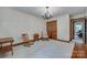 Bright bedroom features hardwood floors, neutral walls, and natural light from a window at 10215 Balmoral Cir, Charlotte, NC 28210