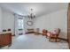 Spacious bedroom with hardwood floors, neutral walls, and natural light from large windows at 10215 Balmoral Cir, Charlotte, NC 28210