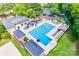 Aerial view of community pool featuring lounge chairs, umbrellas and expansive pool at 10215 Balmoral Cir, Charlotte, NC 28210