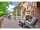 Comfortable deck with lounge chairs, an outdoor seating area with a table, and an entrance to the house at 10215 Balmoral Cir, Charlotte, NC 28210