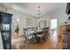 Light-filled dining room featuring hardwood floors and classic decor at 10215 Balmoral Cir, Charlotte, NC 28210