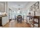 This is a bright and airy dining room with a table, chairs, and a view of the backyard at 10215 Balmoral Cir, Charlotte, NC 28210