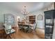 Elegant dining room with hardwood floors, chandelier, and classic furnishings at 10215 Balmoral Cir, Charlotte, NC 28210