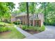 Charming brick home featuring manicured landscaping and a welcoming front porch at 10215 Balmoral Cir, Charlotte, NC 28210