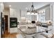 The kitchen features granite counters, an island with seating, a stainless sink, and white cabinets at 10215 Balmoral Cir, Charlotte, NC 28210