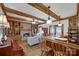 Spacious living room with fireplace, built-in features, and an adjoining bar area at 10215 Balmoral Cir, Charlotte, NC 28210