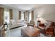 Bright living room with plush seating, natural light, and a neutral color palette at 10215 Balmoral Cir, Charlotte, NC 28210