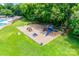 Aerial view of community playground featuring colorful slides and play equipment on a grassy area at 10215 Balmoral Cir, Charlotte, NC 28210