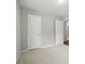 This bedroom has neutral paint, carpet and trim, with 2 closet doors at 107 S Branch St, Monroe, NC 28112