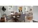 Cozy dining room, featuring a table with four chairs, and an open connection to the living room at 107 S Branch St, Monroe, NC 28112