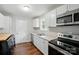 Modern kitchen featuring white cabinets, stainless steel appliances, and beautiful countertops at 107 S Branch St, Monroe, NC 28112