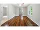 Sun-drenched living room featuring hardwood floors, neutral paint and an open design at 107 S Branch St, Monroe, NC 28112