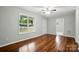 Spacious, sun-filled living room featuring hardwood floors and neutral paint at 107 S Branch St, Monroe, NC 28112