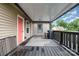 This deck features a white patterned rug, a black railing, and a view of the neighborhood at 1125 Bethel Rd, Charlotte, NC 28208