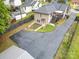 View of the home's backyard and driveway space, offering a private and functional outdoor area at 1125 Bethel Rd, Charlotte, NC 28208