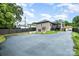 Large backyard with a spacious driveway area perfect for outdoor activities and entertaining guests at 1125 Bethel Rd, Charlotte, NC 28208