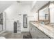 This bathroom features a shower, shelving, and a vanity with granite counters and a framed mirror at 1125 Bethel Rd, Charlotte, NC 28208