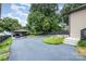 View of the expansive driveway with detached garage, providing ample parking at 1125 Bethel Rd, Charlotte, NC 28208