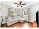 Cozy living room featuring hardwood floors, large windows and a comfortable sectional sofa at 1125 Bethel Rd, Charlotte, NC 28208