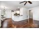 Open concept living space flowing into the kitchen, highlighted by hardwood floors and natural light at 1125 Bethel Rd, Charlotte, NC 28208