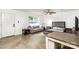This living room features a sofa, bed, table, and ceiling fan at 1125 Bethel Rd, Charlotte, NC 28208