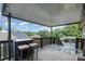 Cozy, covered porch area, perfect for relaxing and enjoying outdoor views of the neighborhood at 1125 Bethel Rd, Charlotte, NC 28208