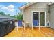 The outdoor back deck features a grill, seating, and direct access to inside through sliding glass doors at 1209 Rainbow Dr, Kannapolis, NC 28081