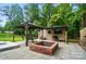 Backyard featuring a gazebo, shed with TV, fire pit and a fully fenced lawn for outdoor entertainment and relaxation at 1209 Rainbow Dr, Kannapolis, NC 28081
