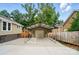 Attached carport with a concrete floor offers covered parking and protection from the elements at 1209 Rainbow Dr, Kannapolis, NC 28081