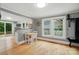 Bright dining area with hardwood floors, white trim, and an open concept to kitchen at 1209 Rainbow Dr, Kannapolis, NC 28081